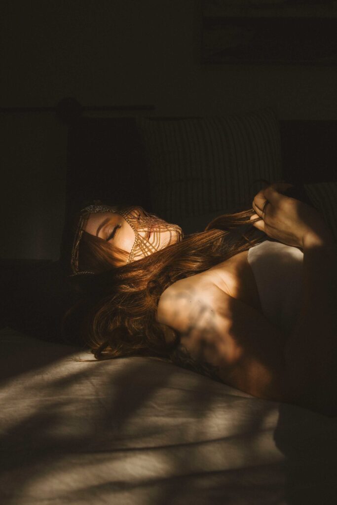 Ava Marie is lounging gracefully in a sun-soaked room, her face partly veiled, relishing a peaceful moment of tranquility. Ava Marie Halifax's Elite Independent Companion